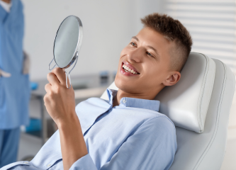 Dental implant bridge for replacing multiple missing teeth